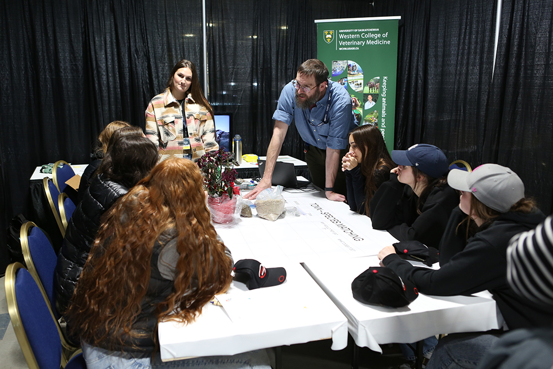 WCVM student and professor give a talk to young students